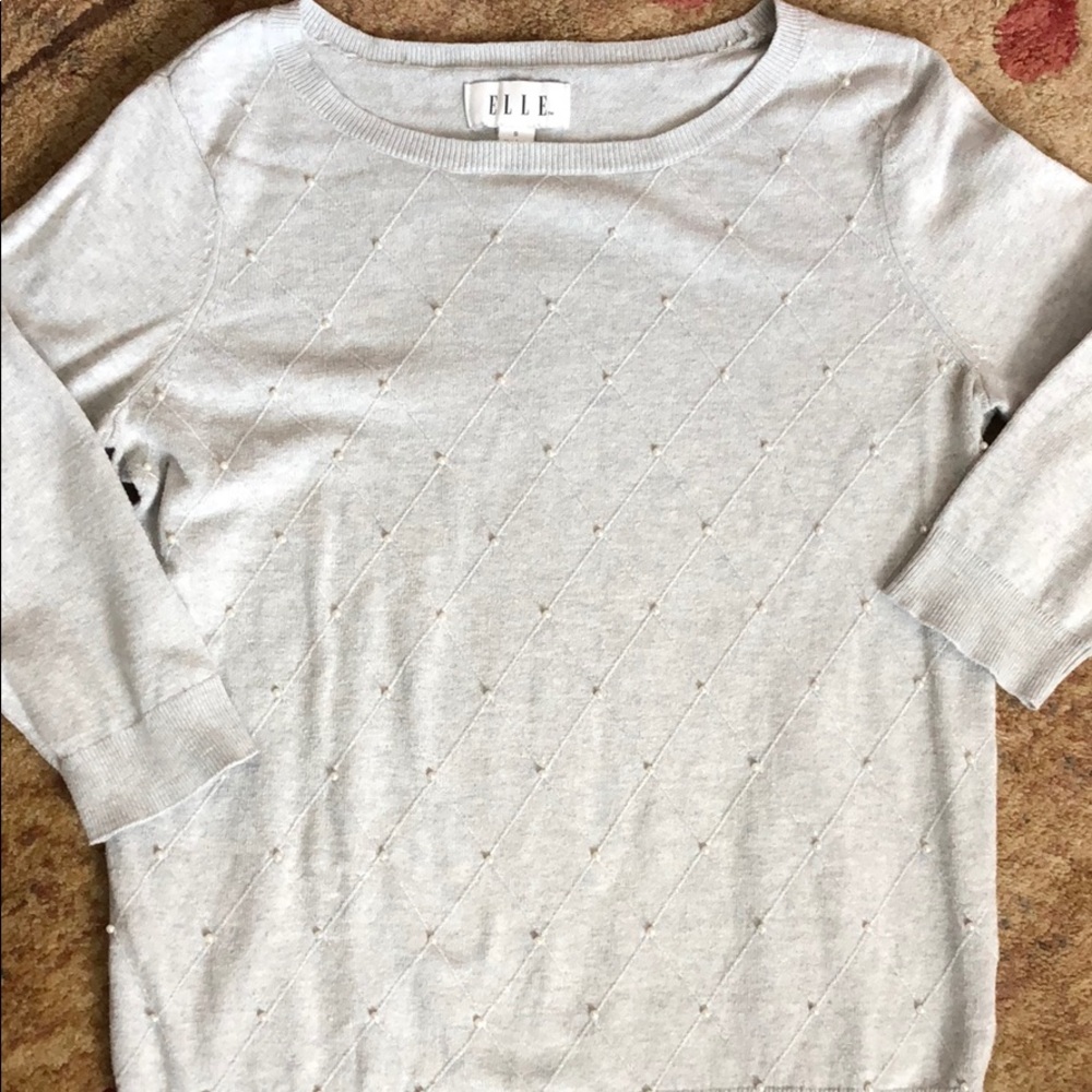 Grey sweater with beaded design